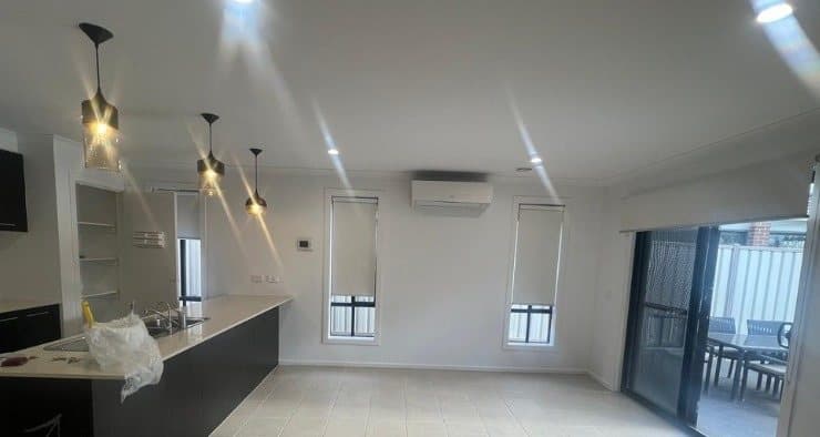 Kitchen and dining area finished in white, coverings removed