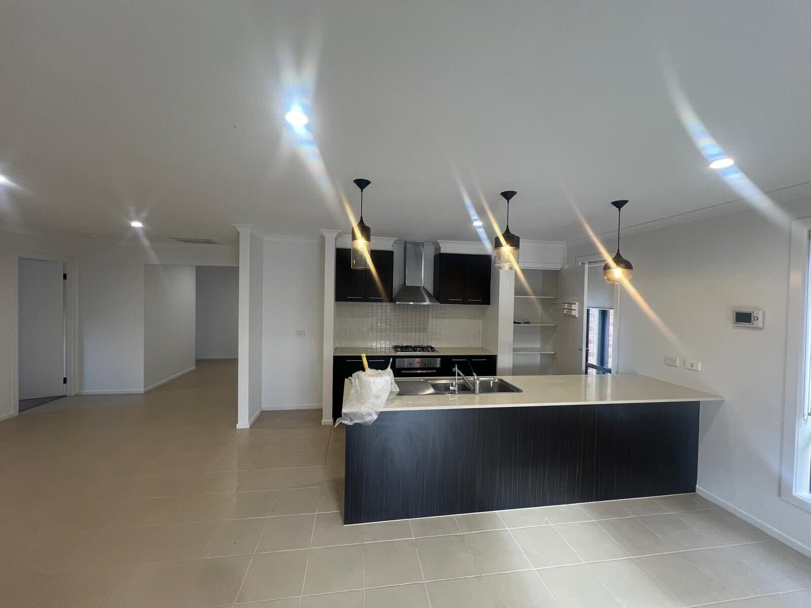 Open kitchen and living area after a full interior repaint